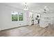 Beautifully bright kitchen featuring white cabinets and an island with views into the living room at 4148 Emerald North Dr, Decatur, GA 30035