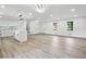 Open-concept living room with hardwood floors, natural light, and an island at 4148 Emerald North Dr, Decatur, GA 30035