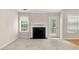 Cozy living room features a fireplace, hardwood floors, and natural light at 1452 Evanston Ln, Marietta, GA 30062