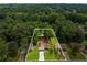 An aerial view of a home, in a neighborhood, with a boundary line highlighting the lot at 2090 Rocky Mill Drive, Lawrenceville, GA 30044