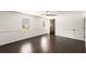 Large bedroom with dark hardwood floors and a rustic barn door at 2090 Rocky Mill Drive, Lawrenceville, GA 30044