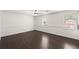 Large bedroom with wood floors, natural light, and neutral paint colors at 2090 Rocky Mill Drive, Lawrenceville, GA 30044