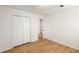 Bedroom featuring a closet and wood-look flooring at 2090 Rocky Mill Drive, Lawrenceville, GA 30044