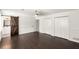 Spacious bedroom with dark wood flooring, ceiling fan, and barn door to bathroom at 2090 Rocky Mill Drive, Lawrenceville, GA 30044