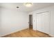 Bright bedroom with wood floors, fresh white walls, and ample closet space at 2090 Rocky Mill Drive, Lawrenceville, GA 30044