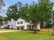 Well-maintained home features a charming facade and spacious front yard at 2090 Rocky Mill Drive, Lawrenceville, GA 30044