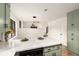 The kitchen features a quartz countertop island, and an open view of the living room at 2090 Rocky Mill Drive, Lawrenceville, GA 30044