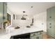 Kitchen with breakfast bar, green cabinetry, white countertops, and view to the living room at 2090 Rocky Mill Drive, Lawrenceville, GA 30044