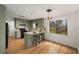 Stylish kitchen with modern appliances, light green cabinets, and a breakfast bar at 2090 Rocky Mill Drive, Lawrenceville, GA 30044