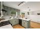 Kitchen with green cabinetry, white countertops, and stainless steel appliances at 2090 Rocky Mill Drive, Lawrenceville, GA 30044