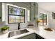Close up on a corner of the kitchen featuring white countertops and green cabinets at 2090 Rocky Mill Drive, Lawrenceville, GA 30044