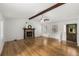 Spacious living room with wood-look floors, stone fireplace, and a ceiling fan at 2090 Rocky Mill Drive, Lawrenceville, GA 30044