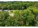 A neighborhood mostly hidden under green trees, a street barely visible at 2090 Rocky Mill Drive, Lawrenceville, GA 30044