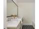 Bathroom featuring a double vanity, black and white hexagonal tile floor, and modern fixtures at 38 Mildred Nw Pl, Atlanta, GA 30318