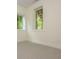 Bright room showcasing natural light from two windows and carpet flooring at 38 Mildred Nw Pl, Atlanta, GA 30318