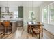 Dining area features wood table with decorative chairs and pendant lighting at 38 Mildred Nw Pl, Atlanta, GA 30318