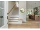 Entryway with staircase, wood flooring, and view into kitchen at 38 Mildred Nw Pl, Atlanta, GA 30318
