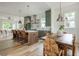 An open-concept kitchen with an island, dining table, and chairs at 38 Mildred Nw Pl, Atlanta, GA 30318