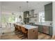 Spacious kitchen with stainless steel appliances, large island, and view into living area at 38 Mildred Nw Pl, Atlanta, GA 30318