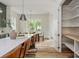 Bright, open kitchen featuring a large island with seating and a walk-in pantry with wood shelves at 38 Mildred Nw Pl, Atlanta, GA 30318