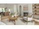 Open living area with fireplace, seating, and kitchen island in the background at 38 Mildred Nw Pl, Atlanta, GA 30318