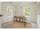 Bright office space with natural light, hardwood desk, and views of lush greenery at 38 Mildred Nw Pl, Atlanta, GA 30318