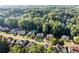 Scenic aerial view of residential homes surrounded by lush green trees at 660 Briarleigh Way, Woodstock, GA 30189