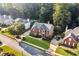 Aerial view of a brick home nestled within a beautifully landscaped community at 660 Briarleigh Way, Woodstock, GA 30189