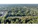 Wide aerial shot of homes in a lush, tree-filled suburban neighborhood at 660 Briarleigh Way, Woodstock, GA 30189