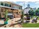 Charming backyard with stone patio, fire pit, and covered deck for outdoor living at 660 Briarleigh Way, Woodstock, GA 30189