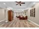 Spacious finished basement with bar, seating, and wood-look flooring at 660 Briarleigh Way, Woodstock, GA 30189