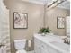 Bathroom with toilet, vanity with a white countertop, and a shower/tub combo at 660 Briarleigh Way, Woodstock, GA 30189