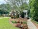 Attractive clubhouse surrounded by landscaped gardens, offering a welcoming community gathering space at 660 Briarleigh Way, Woodstock, GA 30189
