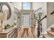 Spacious front foyer with tall ceilings, arched windows, staircase, and natural light at 660 Briarleigh Way, Woodstock, GA 30189