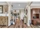 Inviting foyer with hardwood floors, a staircase, and a view into the living room at 660 Briarleigh Way, Woodstock, GA 30189