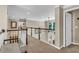 Spacious second floor hallway boasting views of the living room with decorative railing and natural light at 660 Briarleigh Way, Woodstock, GA 30189