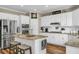 Updated kitchen with stainless steel appliances, granite countertops, and a central island for meal preparation at 660 Briarleigh Way, Woodstock, GA 30189