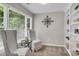 Bright sitting room featuring natural light from windows and decorative built-in shelving at 660 Briarleigh Way, Woodstock, GA 30189
