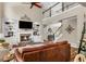 Living room with a second-floor landing, stone fireplace, and comfortable seating arrangement at 660 Briarleigh Way, Woodstock, GA 30189