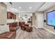 Well-appointed living room that features a full bar area with gorgeous wood cabinetry at 660 Briarleigh Way, Woodstock, GA 30189