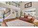 Inviting living room with staircase to second floor, connecting to kitchen and dining at 660 Briarleigh Way, Woodstock, GA 30189
