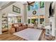 Spacious living room boasts soaring ceilings, fireplace, and natural light through large windows at 660 Briarleigh Way, Woodstock, GA 30189