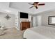 Spacious main bedroom with trey ceiling, ceiling fan, large dresser and carpeted floor at 660 Briarleigh Way, Woodstock, GA 30189