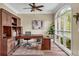 Home office featuring built-in shelving, a large window, and a comfortable workspace at 660 Briarleigh Way, Woodstock, GA 30189