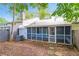 Enclosed screened porch and exterior AC unit in a partially shaded backyard at 937 Ohara Drive Dr, Jonesboro, GA 30236