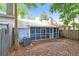 Screened-in back porch, exterior AC unit and a partially fenced-in backyard at 937 Ohara Drive Dr, Jonesboro, GA 30236