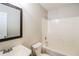Well-lit bathroom with a vanity, mirror, toilet, and bathtub with shower at 937 Ohara Drive Dr, Jonesboro, GA 30236