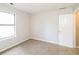 Bedroom featuring neutral carpet, natural light from a window, and a closet door at 937 Ohara Drive Dr, Jonesboro, GA 30236