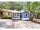 Attractive home with blue exterior, white picket fence, and mature trees at 937 Ohara Drive Dr, Jonesboro, GA 30236