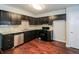 Modern kitchen with dark cabinets, stainless steel appliances, and granite countertops at 937 Ohara Drive Dr, Jonesboro, GA 30236